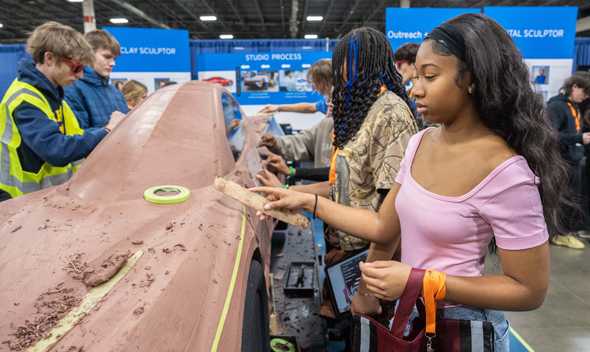 Students exploring clay sculpting at MiCareerQuest