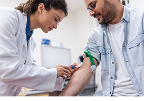 Phlebotomist taking blood