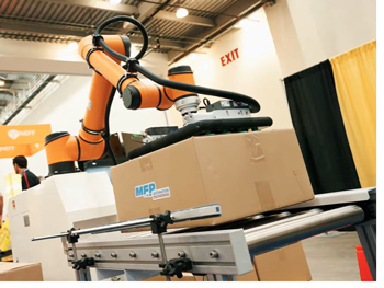 Robotic arm packing a box