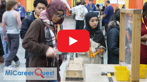 Video thumbnail showing students at Michigan Career Quest Southeast trying out construction jobs.