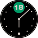 An analog clock with a black face with the number 18 at the top