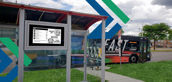 A SMART bus at a bus shelter.