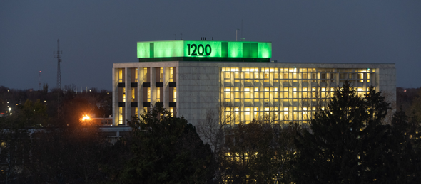 Oakland County campus building lit up in green for Operation Green Light for Veterans.