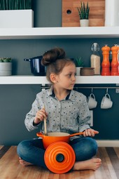 girl cooking with pots