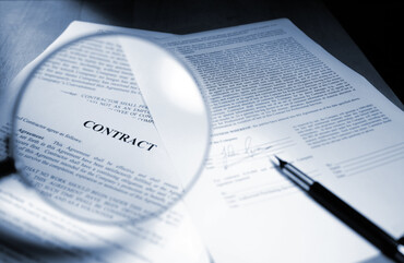 Contract and magnifying glass