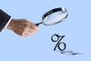 Percent symbol and magnifying glass
