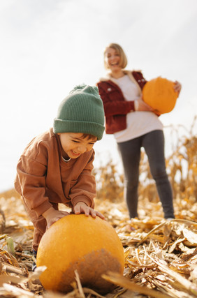 Fall with child and pumpkin