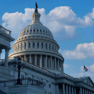 U.S. Capitol dome image blue clouds in sky