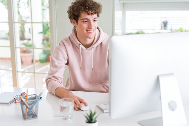 Young man in front of a computer