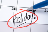 Calendar with the word "holiday" circled in red