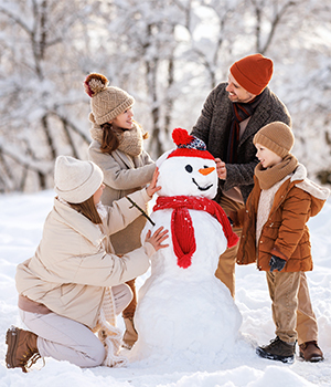 Family around snow sculpture