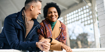 a happy couple on a porch