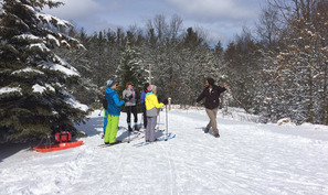 skiers in a ski class