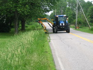 Mower along the side of the road