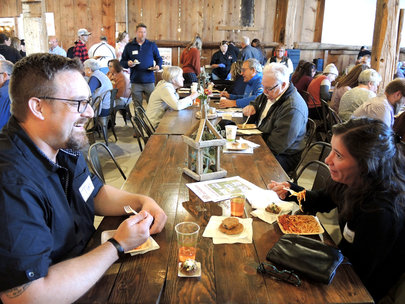 Folks enjoy small plates during a previous Farms are the Tapas event.