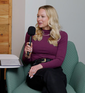 Katie speaking into microphone