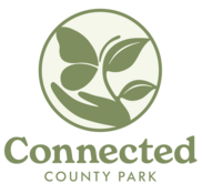 Connected County Park logo with icon showing a hand holding a butterfly with a leaf to the side