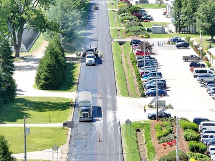 Paving operations taking place on 120th Avenue in Robinson Township