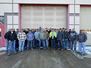 Group photo of OCRC employees at Grand Haven maintenance garage