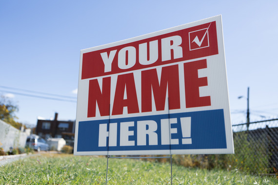 Political sign in a yard stating 'your name here!'