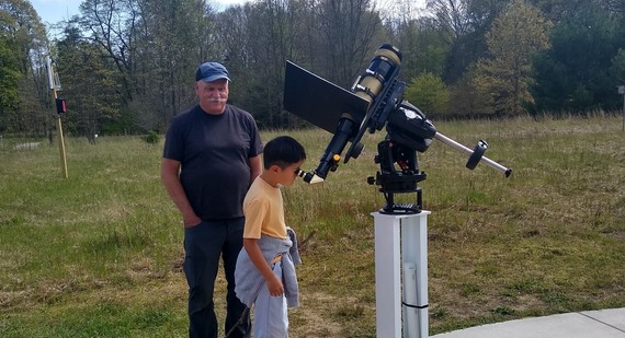 Looking through telescope at National Astronomy Day
