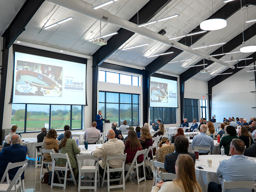 Wide view of Visioning for Growth Summit. Ottawa County Administrator Patrick Waterman speaks to attendees.