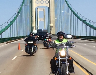 SOS Johnson riding on Mackinac Bridge