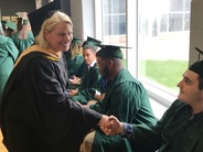 SOS shakes hands with grads