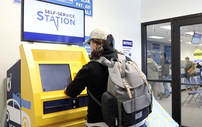 Customer using kiosk