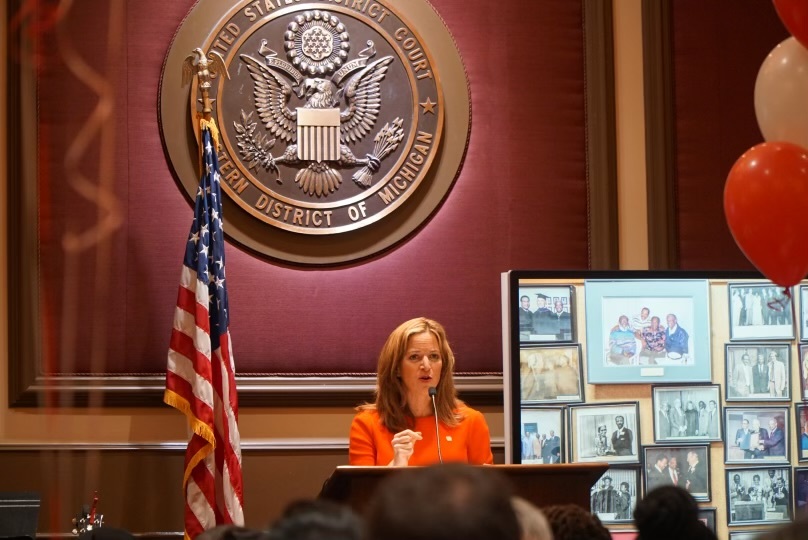 Secretary Benson at podium