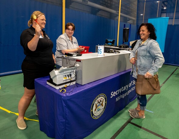 Rachell Stewart rings the bell with MDOS staff 