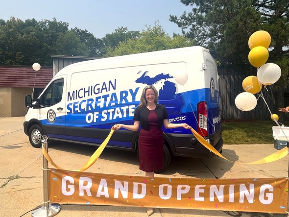 Secretary holding ribbon