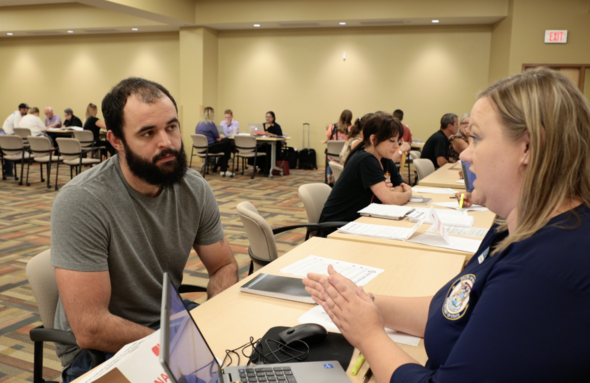 Clinic participant listens to staff member