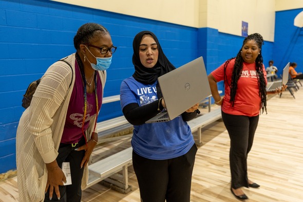 Clinic staff member helps attendee