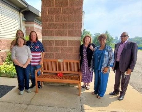 MET in front of bench