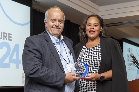 MIC Chairperson, Palencia Mobley, P.E., presenting John Weiss with the Asset Management Ambassador Award