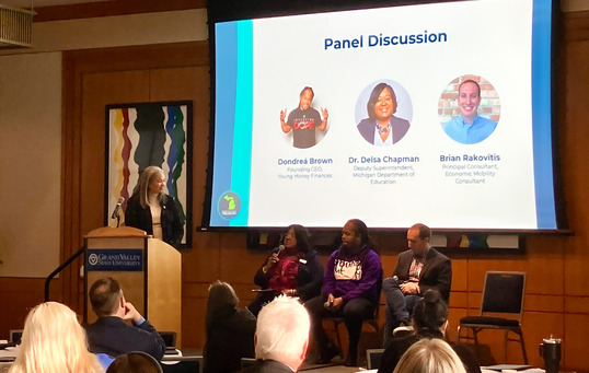 State Treasurer Rachael Eubanks moderates a panel discussion about financial empowerment at the MI Money Matters forum in Grand Rapids on Oct. 23.