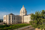 The northeast quadrant of the Minnesota Capitol lit by the morning sun.