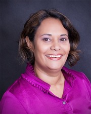 Sarah Maheswaran, a woman with brown hair and light brown skin in a pink shirt