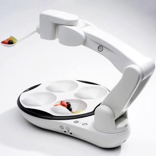 Obi is a robot with four food compartments and a single arm that holds a spoon