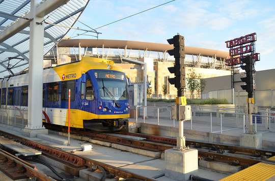 Light rail train approaches a station area