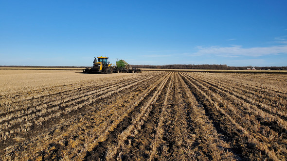 Tilling equipment in a wheat field