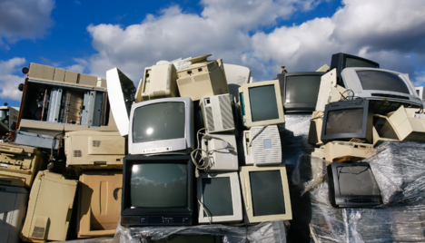stacks of electronics with a blue sky in the background 