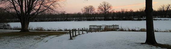 Courthouse Lake frozen with a snowy landscape and trees