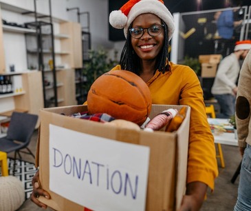 Woman holding a donation box