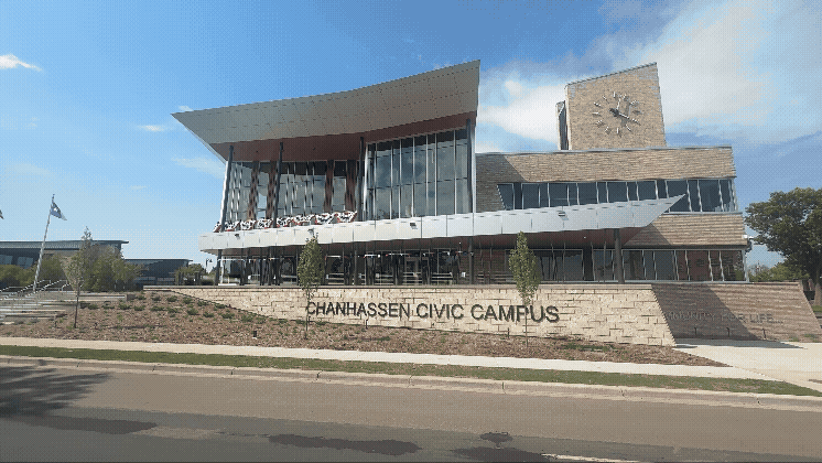 GIF of Chanhassen Civic Campus and a balcony with flags drapped in preparation for the 4th of July Parade
