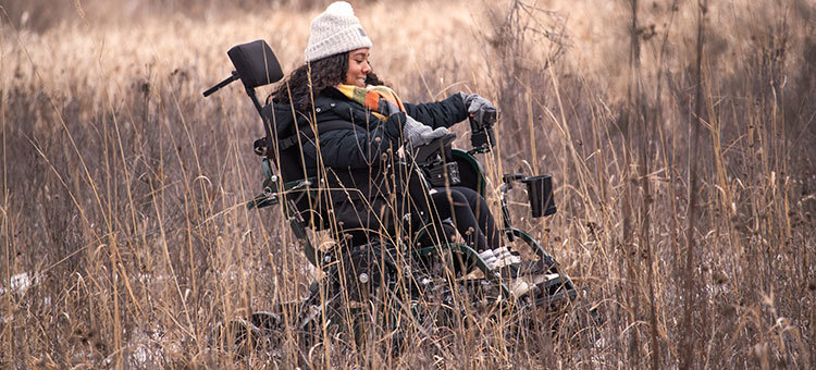 Brittanie Wilson in an all-terrain Track Chair