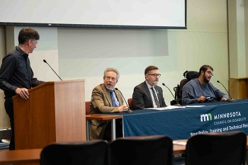 Four people are participating in a panel during the MCD Legislative Forum.