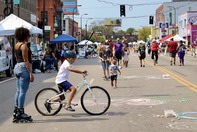 people at the open streets event on west broadway