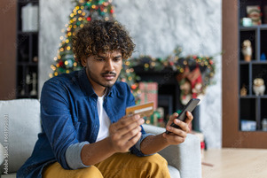 Man holding gift card or credit card